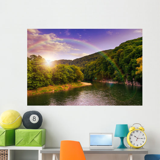 river flows by rocky shore near the autumn mountain forest Wall Mural