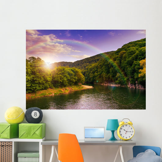 river flows by rocky shore near the autumn mountain forest Wall Mural