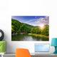 river flows by rocky shore near the autumn mountain forest Wall Mural