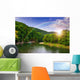 river flows by rocky shore near the autumn mountain forest Wall Mural