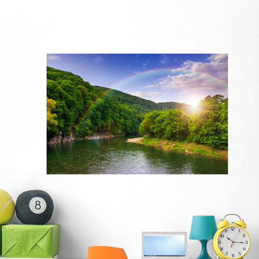 river flows by rocky shore near the autumn mountain forest Wall Mural