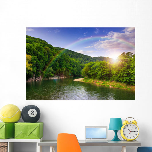 river flows by rocky shore near the autumn mountain forest Wall Mural