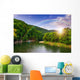 river flows by rocky shore near the autumn mountain forest Wall Mural