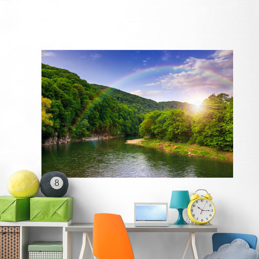 river flows by rocky shore near the autumn mountain forest Wall Mural