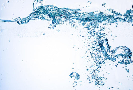 Water and air bubbles over white background. Splash 