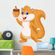 Squirrel cartoon with nut Wall Decal