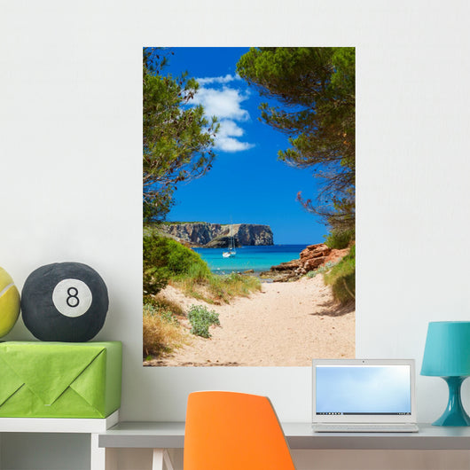 View on Cala Algaiarens from sand pathway to the beach 