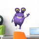 A spotted monster waving and looking very happy. 