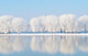 winter landscape with beautiful reflection in the water 