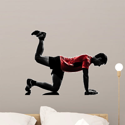 Man Exercising Fitness Workout shown on a wall