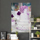 White Wedding Cake Decorated With Purple Flowers 