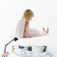 little girl sadly sitting in white dress and angel wings Wall Decal