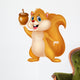 Squirrel cartoon with nut Wall Decal