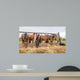 Horses eating at a feed fence 