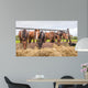 Horses eating at a feed fence 