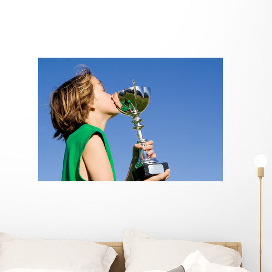 happy successful winner with cup or trophy Wall Mural