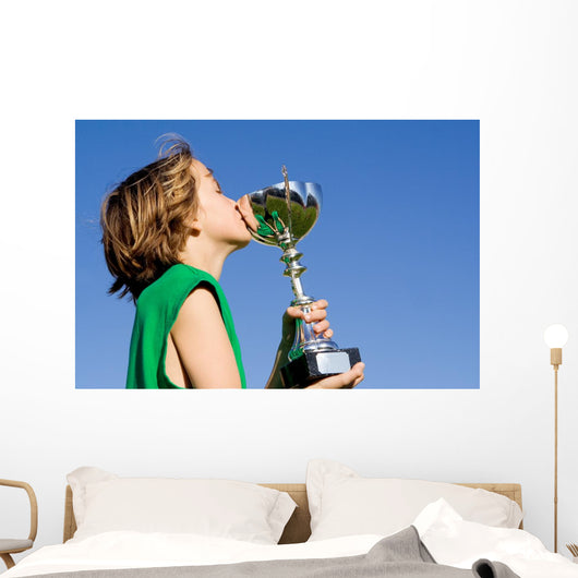 happy successful winner with cup or trophy Wall Mural