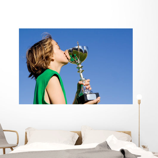 happy successful winner with cup or trophy Wall Mural