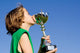 happy successful winner with cup or trophy Wall Mural