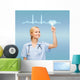 smiling doctor or nurse pointing to cardiogram Wall Mural