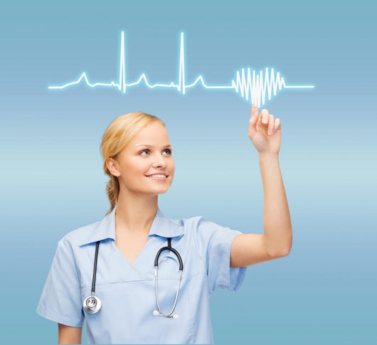 smiling doctor or nurse pointing to cardiogram Wall Mural