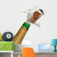 Close up of champagne cork popping with white background Wall Decal