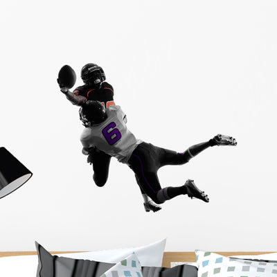 Two American Football Players Wall Decal shown on a wall