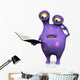 A spotted monster reading book and looking confused. 