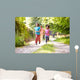 Children Running In Countryside With Father 