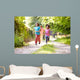Children Running In Countryside With Father 