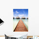 tropical beach: tropical resort and cloudy sky Wall Mural
