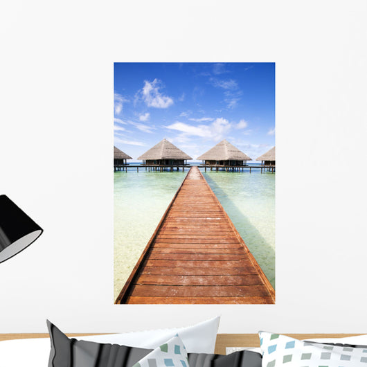tropical beach: tropical resort and cloudy sky Wall Mural