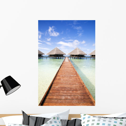 tropical beach: tropical resort and cloudy sky Wall Mural