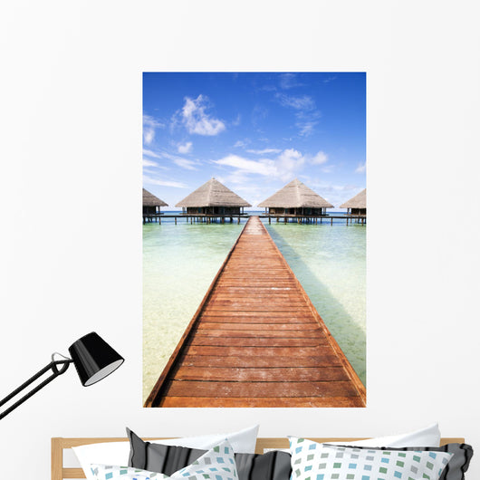 tropical beach: tropical resort and cloudy sky Wall Mural