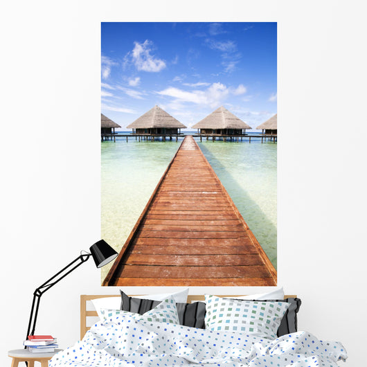 tropical beach: tropical resort and cloudy sky Wall Mural
