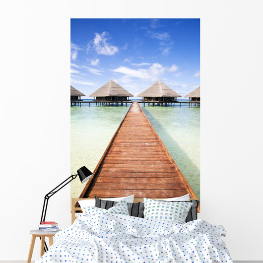 tropical beach: tropical resort and cloudy sky Wall Mural