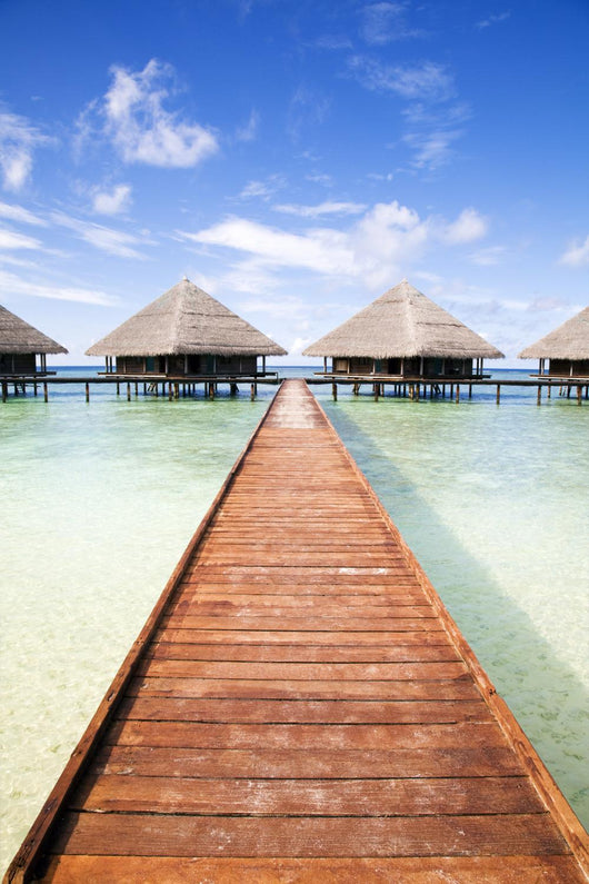 tropical beach: tropical resort and cloudy sky Wall Mural