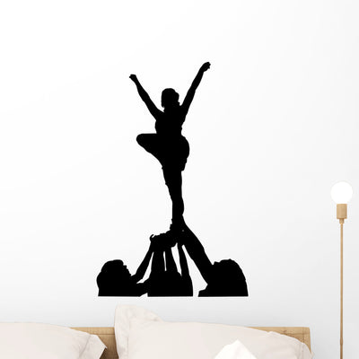 Cheerleaders Silhouette Wall Decal shown on a wall