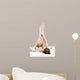 Woman massaging legs lying on white background 