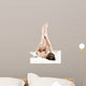 Woman massaging legs lying on white background 