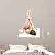 Woman massaging legs lying on white background 