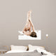 Woman massaging legs lying on white background 