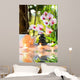 massage composition spa with candles, orchids, stones in garden Wall Mural