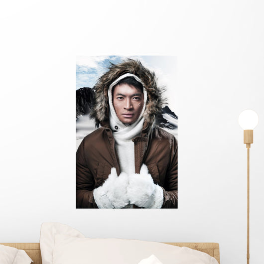 Asian winter sport fashion man in snow mountain landscape. Weari 