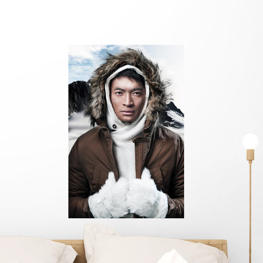 Asian winter sport fashion man in snow mountain landscape. Weari 