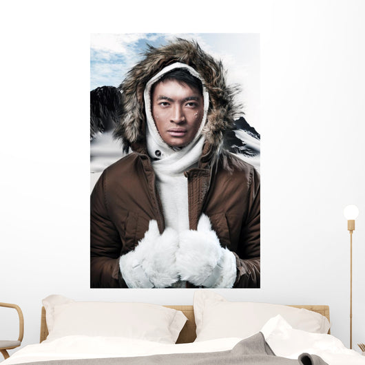 Asian winter sport fashion man in snow mountain landscape. Weari 