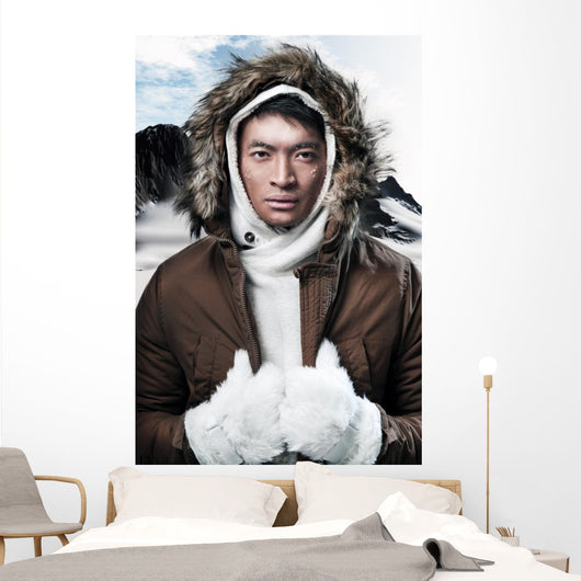Asian winter sport fashion man in snow mountain landscape. Weari 