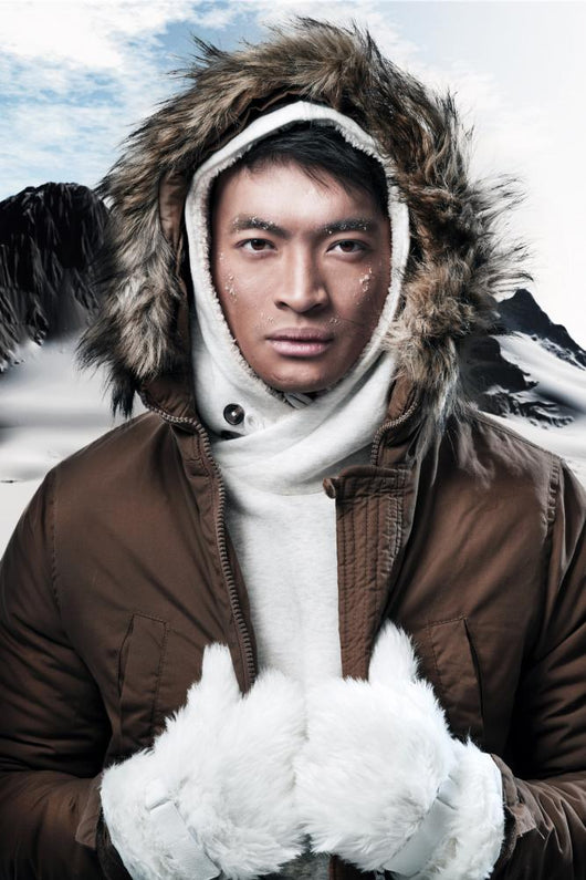 Asian winter sport fashion man in snow mountain landscape. Weari 