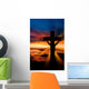 A cross at sundown on the ocean Wall Mural