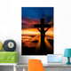 A cross at sundown on the ocean Wall Mural